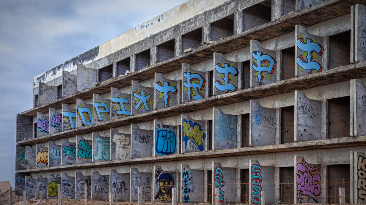 The skeleton of a possible future resort under construction, in the middle of nowhere on the island of Lanzarote, which has become a canvas for writers and graffiti artists